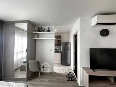 Modern apartment interior with sleek design, featuring a cozy living area, stylish kitchen, and contemporary furnishings.