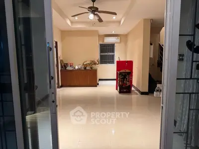 Spacious living room with modern ceiling fan and air conditioning