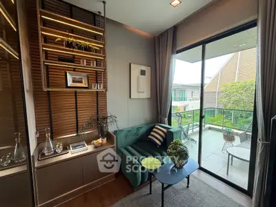 Stylish living room with balcony view, modern decor, and cozy seating area.