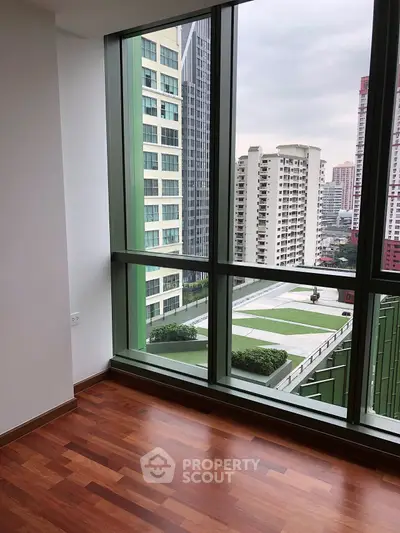 Spacious corner unit with stunning city view and elegant wooden flooring.
