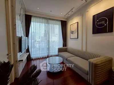 Modern living room with sleek sofa and large window, perfect for urban living.