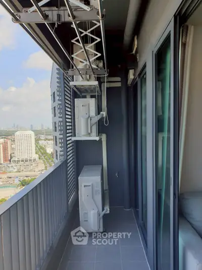 Modern high-rise balcony with city view and air conditioning units