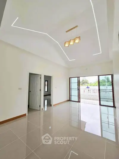 Spacious modern living room with glossy tiles and stylish ceiling lights