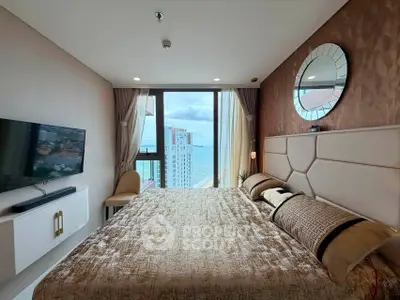 Luxurious bedroom with stunning ocean view and modern decor in high-rise apartment