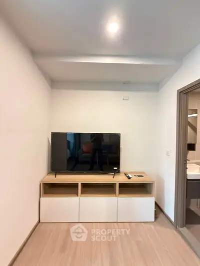 Modern living room with sleek TV setup and minimalist decor