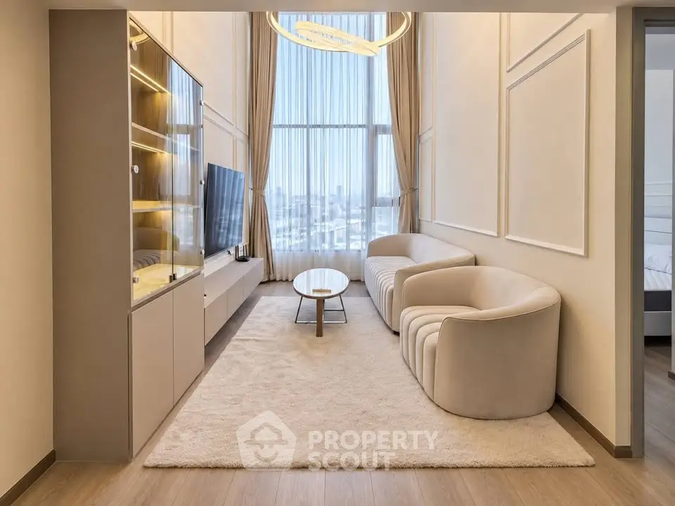 Luxurious modern living room with high ceilings and large windows offering stunning city views.