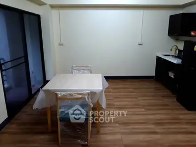 Spacious kitchen with dining area and modern appliances
