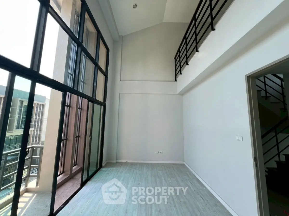 Spacious modern loft with high ceilings and large windows for natural light