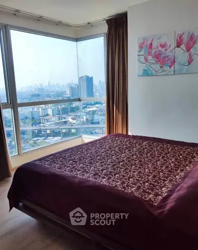 Spacious bedroom with stunning city view and elegant decor