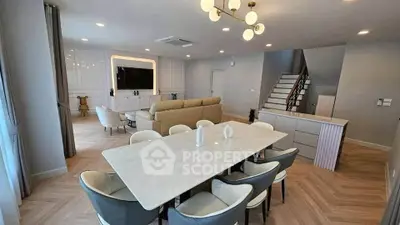 Spacious modern living room with elegant dining area and stylish decor