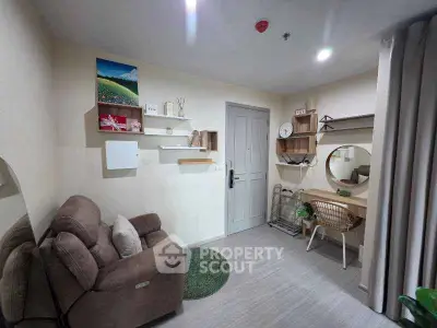 Cozy living room with modern decor and comfortable seating in a stylish apartment.
