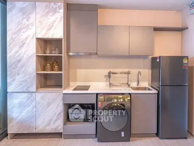 Modern kitchen with sleek appliances and stylish cabinetry