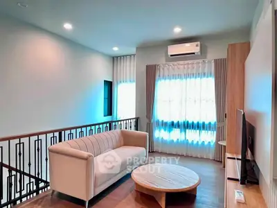 Modern living room with cozy sofa and natural light