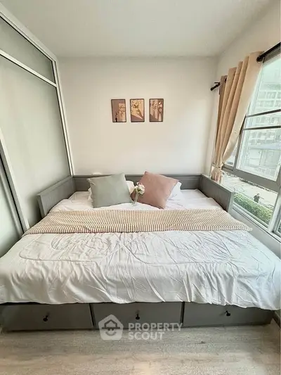 Cozy bedroom with large windows and stylish decor in modern apartment