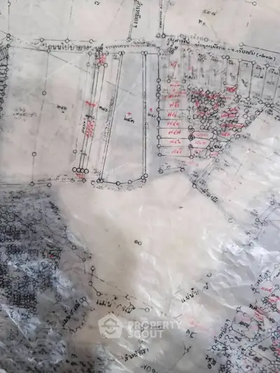 Detailed real estate schematic plan with intricate plot divisions and annotations.