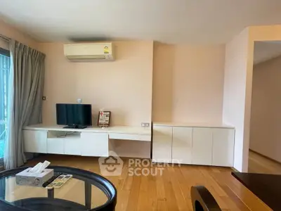 Spacious living room with modern furniture and wooden flooring