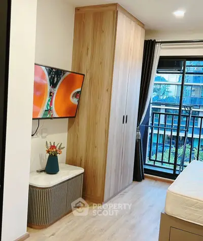 Modern bedroom with balcony view and stylish wooden wardrobe