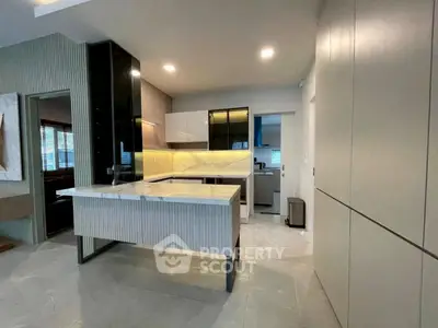 Modern kitchen with sleek cabinetry and open layout design