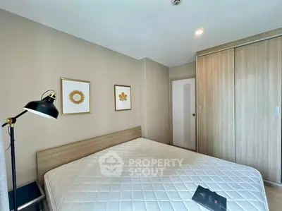 Cozy bedroom with modern decor and ample natural light