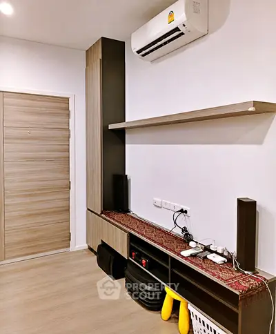 Modern interior with sleek storage and air conditioning in a stylish apartment.