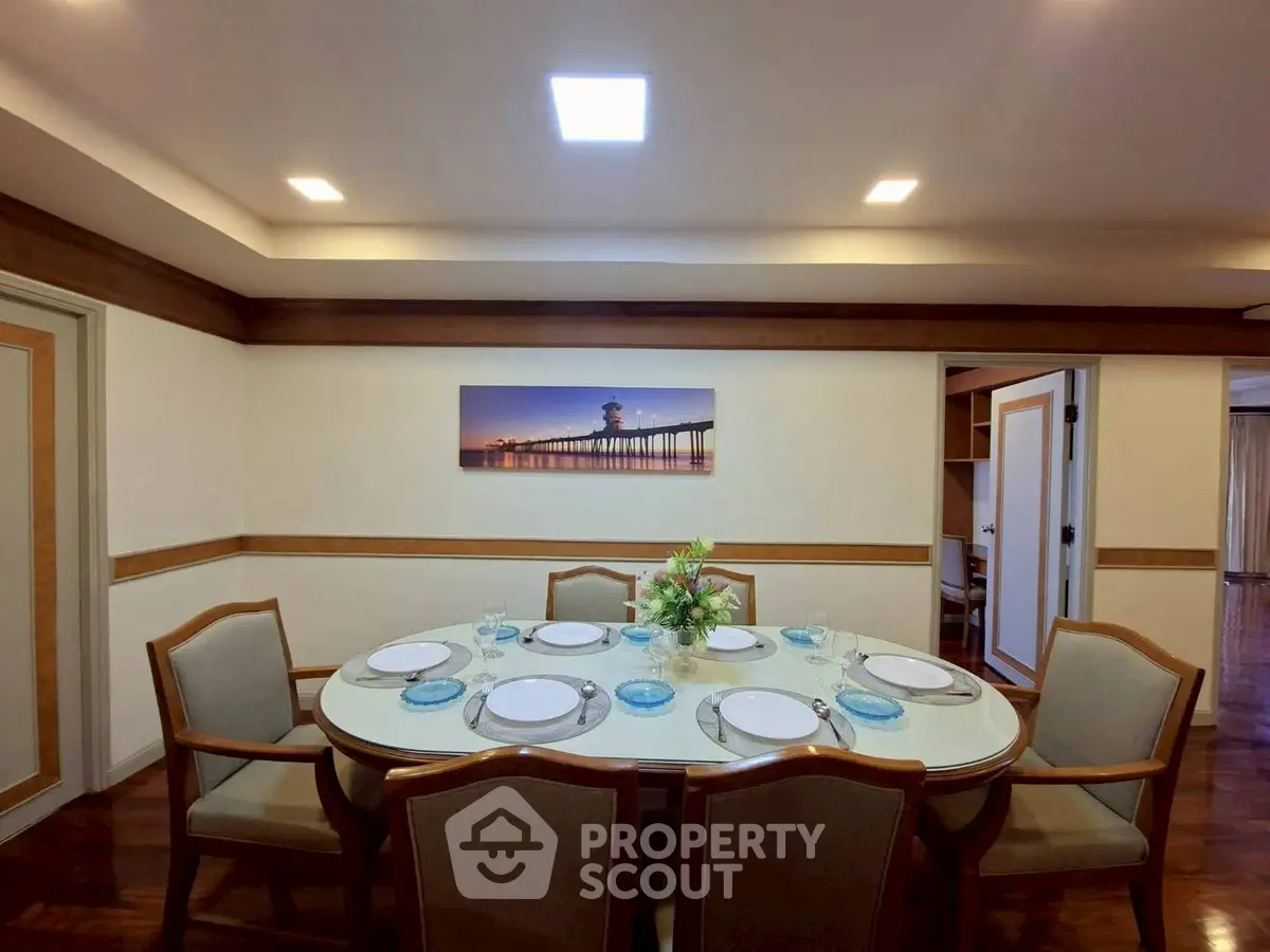 Elegant dining room with a stylish table setting and modern lighting, perfect for hosting gatherings.