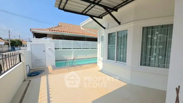 Charming home exterior with private pool and spacious patio, perfect for relaxation and entertaining.