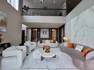 Luxurious modern living room with high ceilings and elegant furniture