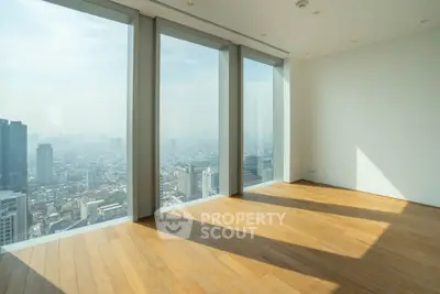 Spacious corner unit with floor-to-ceiling windows offering a breathtaking city view.