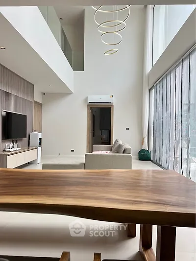 Luxurious modern living room with high ceilings and elegant furniture