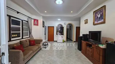 Spacious living room with modern decor and cozy seating area