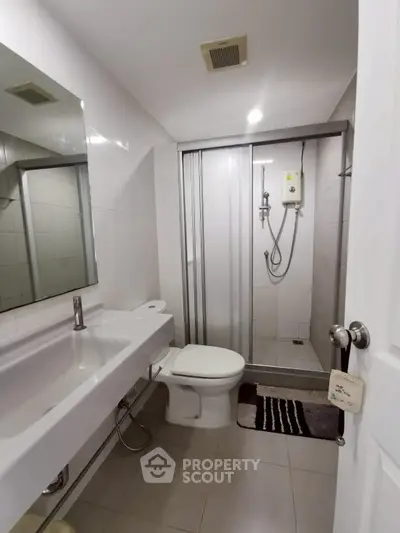 Modern bathroom with sleek shower and contemporary fixtures