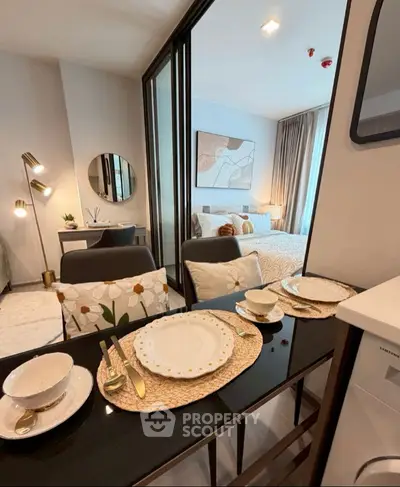 Stylish dining area with elegant table setting and modern decor