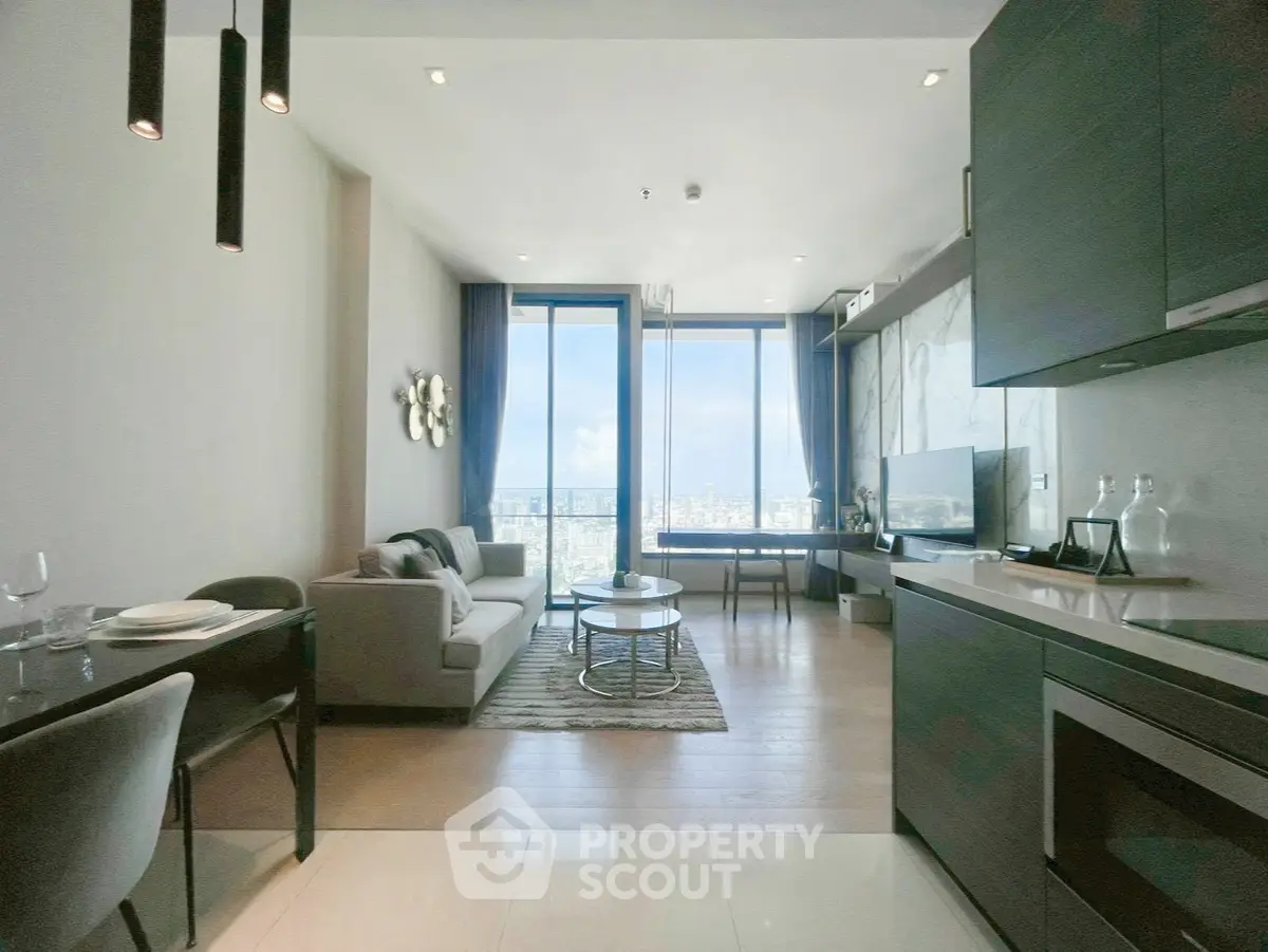 Modern open-plan living room with stunning city view and sleek kitchen design.