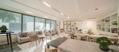 Spacious modern living room with large windows and stylish decor