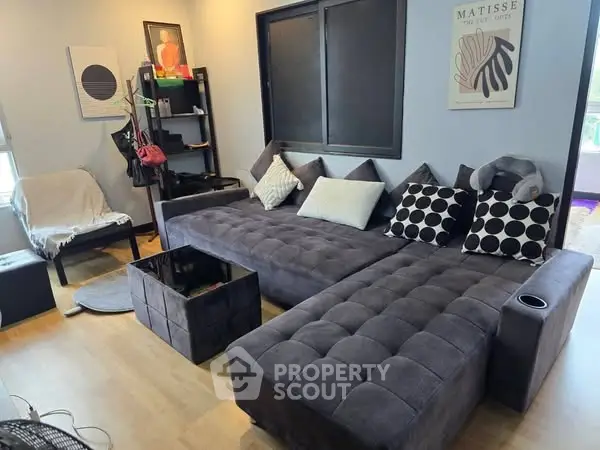 Modern living room with stylish sectional sofa and contemporary decor