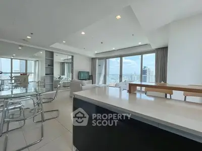 Spacious modern living room with panoramic city view and elegant decor