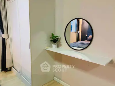 Modern bedroom with stylish mirror and wardrobe, perfect for urban living