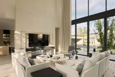 Luxurious modern living room with high ceilings and large windows offering stunning views.