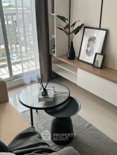 Modern living room with stylish decor and balcony view