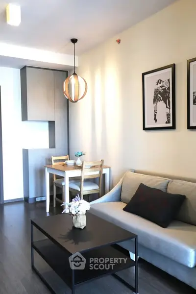 Modern living room with stylish decor and cozy seating area in a contemporary apartment.