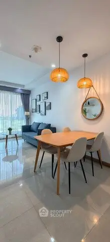 Modern living room with stylish dining area and cozy seating, perfect for relaxation and entertaining.