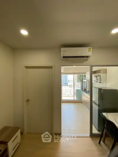 Modern apartment interior with air conditioning and open kitchen layout