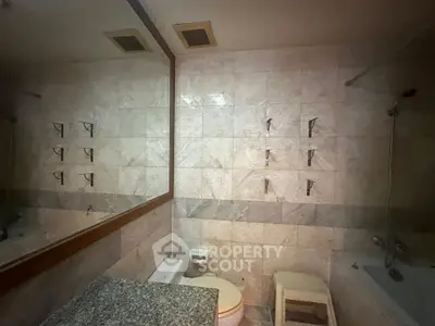 Spacious bathroom with elegant marble tiles and modern fixtures