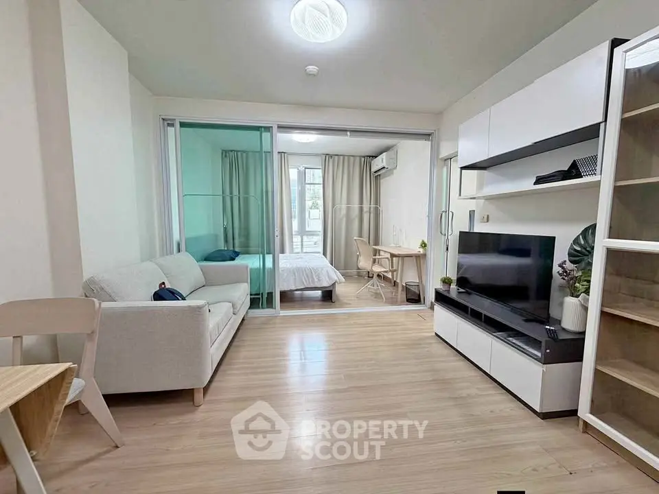 Modern living room with open layout and stylish furniture in a cozy apartment.