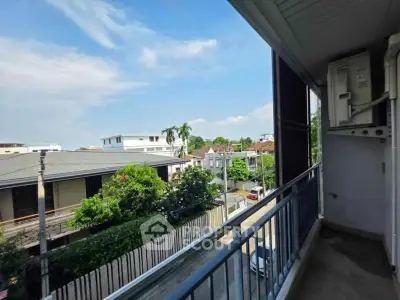 Spacious balcony with scenic neighborhood view in modern apartment