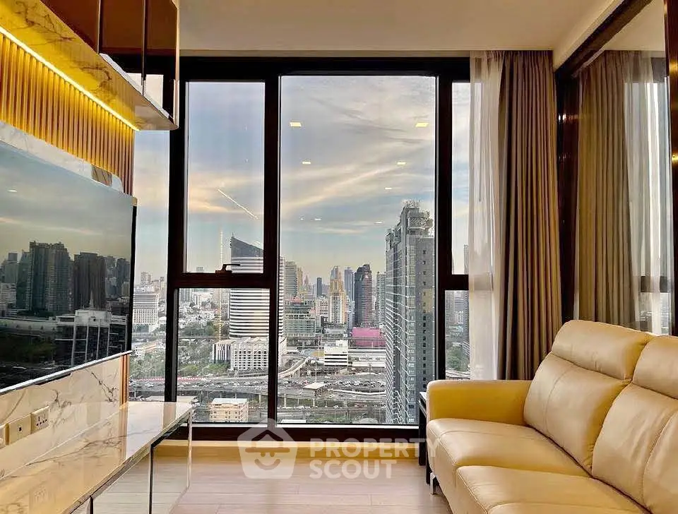Luxurious living room with stunning city skyline view through large windows, featuring elegant decor and cozy seating.