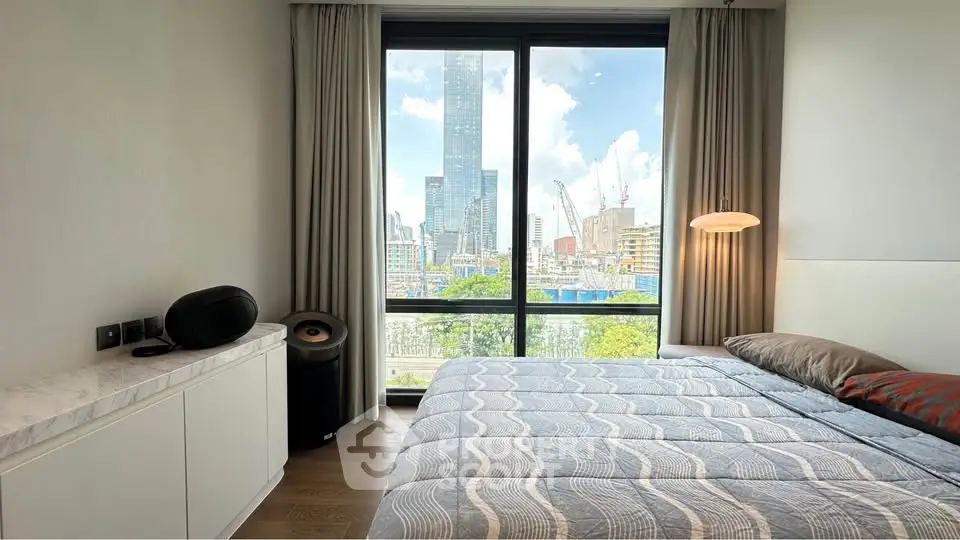 Modern bedroom with stunning city view and elegant decor