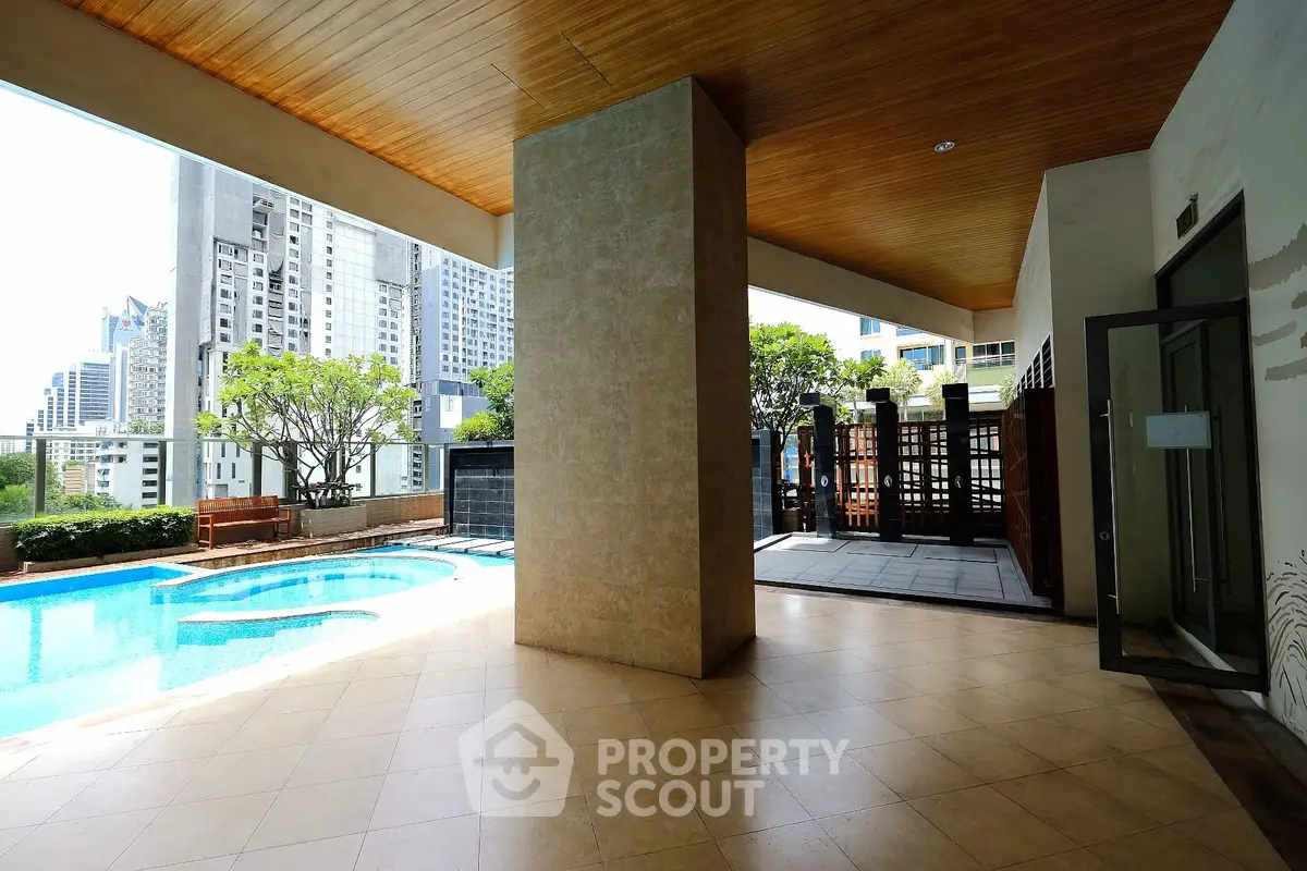 Luxurious rooftop pool area with stunning city views and modern design.