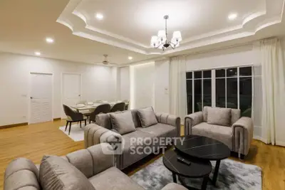 Spacious modern living room with elegant ceiling design and cozy seating area
