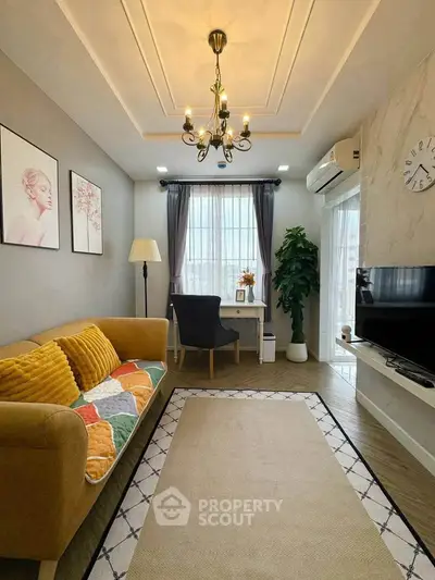 Charming living room with cozy sofa, elegant decor, and natural light, perfect for relaxation and entertainment.